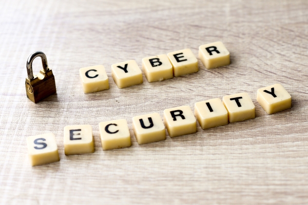cybersecurityletteringwithpadlockonwoodenta20231127051202utc.jpg